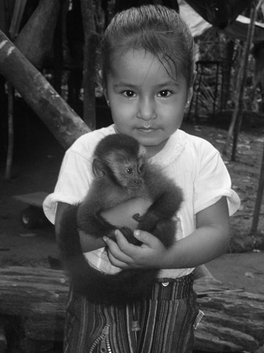 Nallely with pet spider monkey.