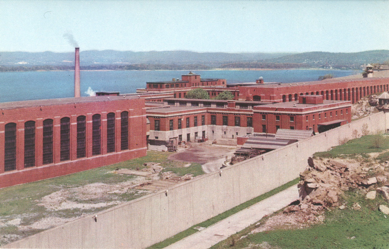 View to the northwest, with B-Block on the left, A-Block to the right, and Messhall Building in the middle. B-Block yard, with more grass than at present, lies in the left foreground. This was probably taken in the 1960s.