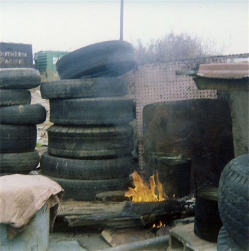 Cooking fire in the house of tires, Bakersfield, California.